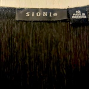 Black flowy dress with beautiful ruffled bottom.Timely for any occasion .